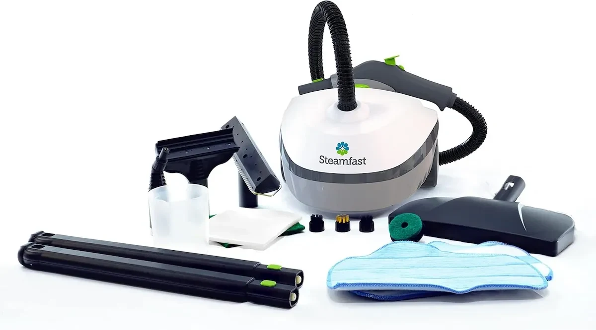 The Steamfast SF-370 Multipurpose Steam Cleaner and its accessories on white background