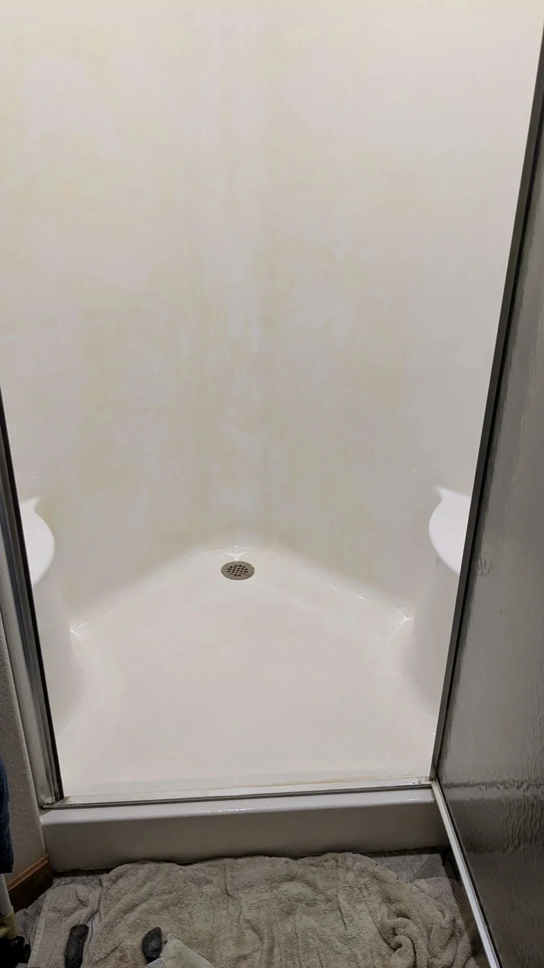 White shower walls were hiding beneath the buildup